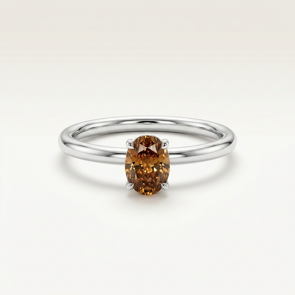 Silver ring with a brown gemstone on a white background::Oval|White Gold